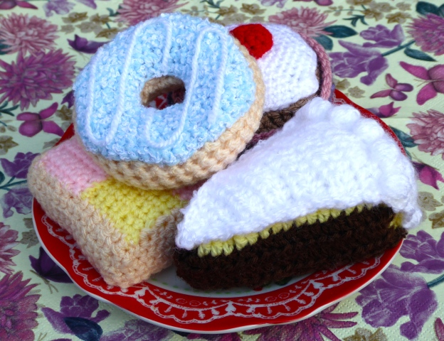 A plate of crocheted cakes