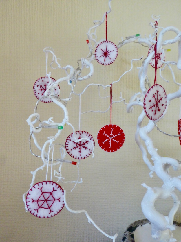 Embroidered snowflakes on felt